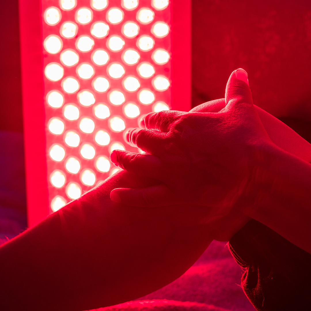 red light therapy device on leg